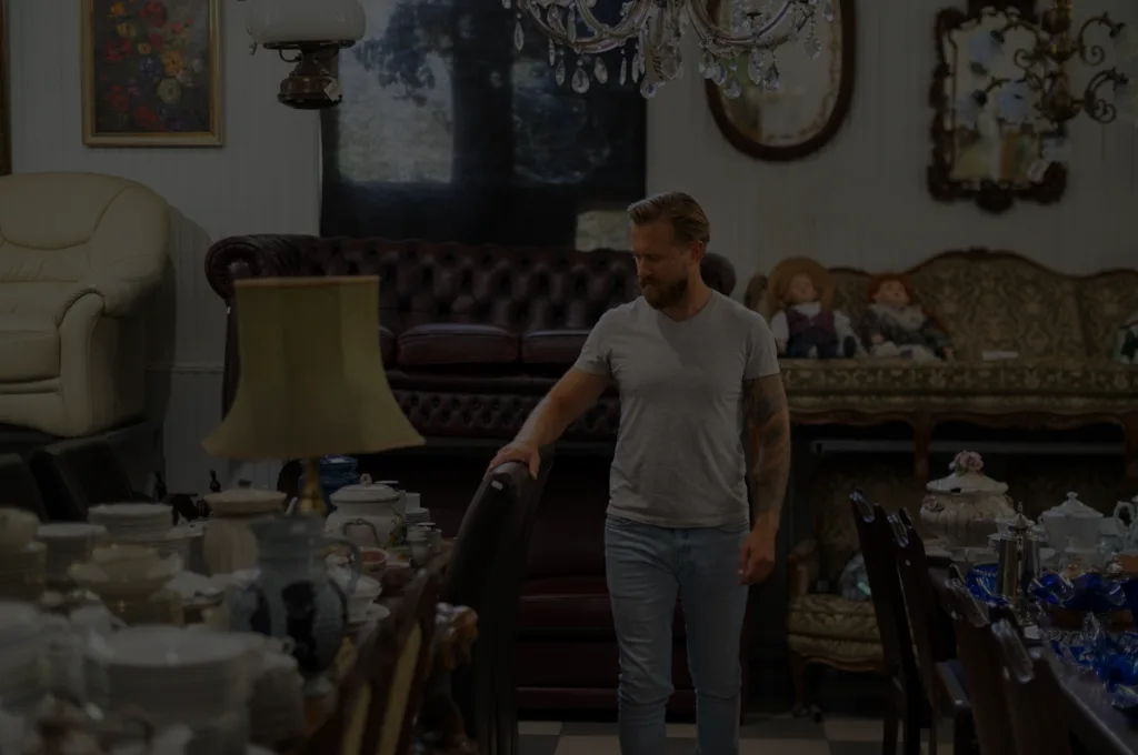 Estate room full of antiques, china, and vintage furniture